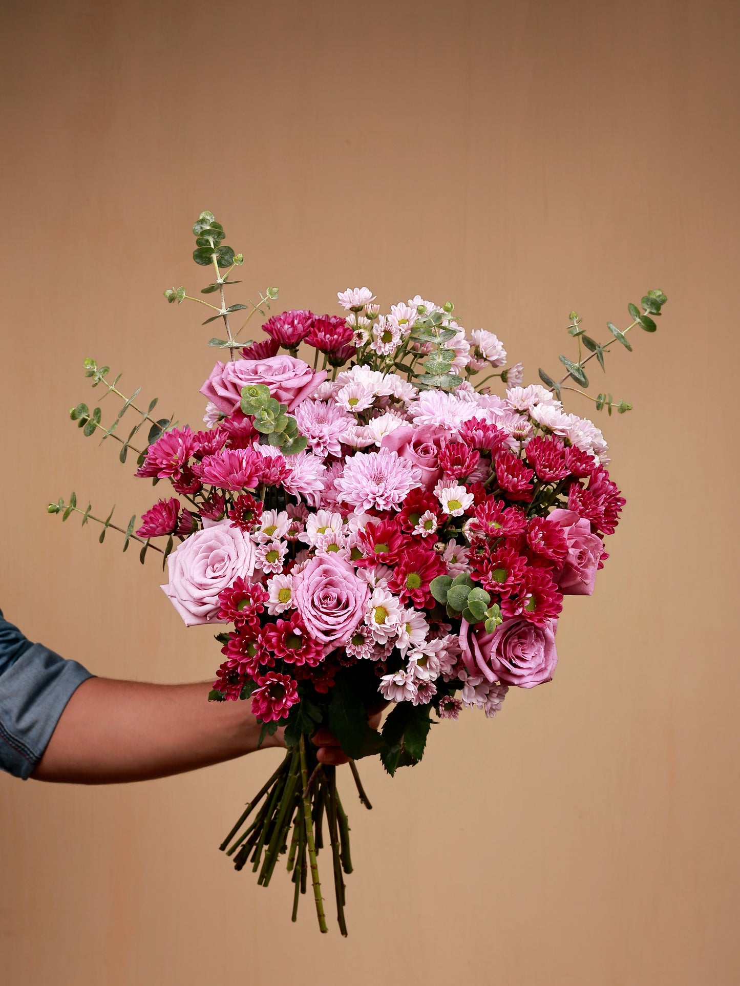 pink flowers in hand