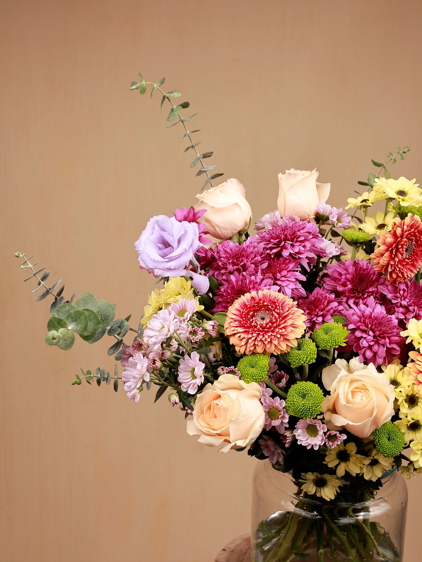 closeup of pech rose-gerbera-chrysanthemum-santini