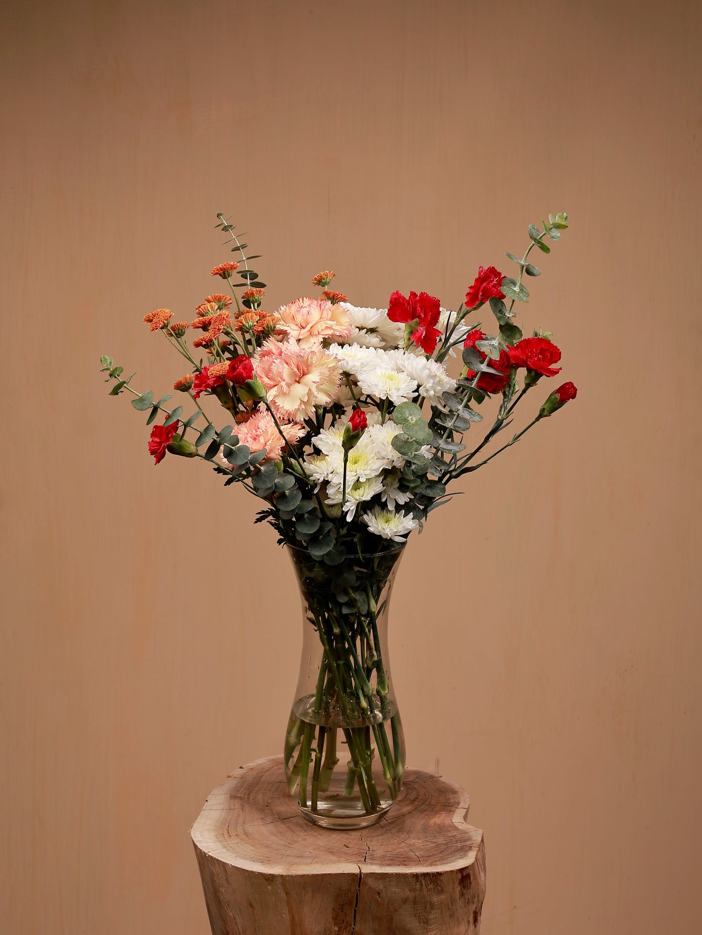 carnation and chrysanthemum flowers n a glass-vase
