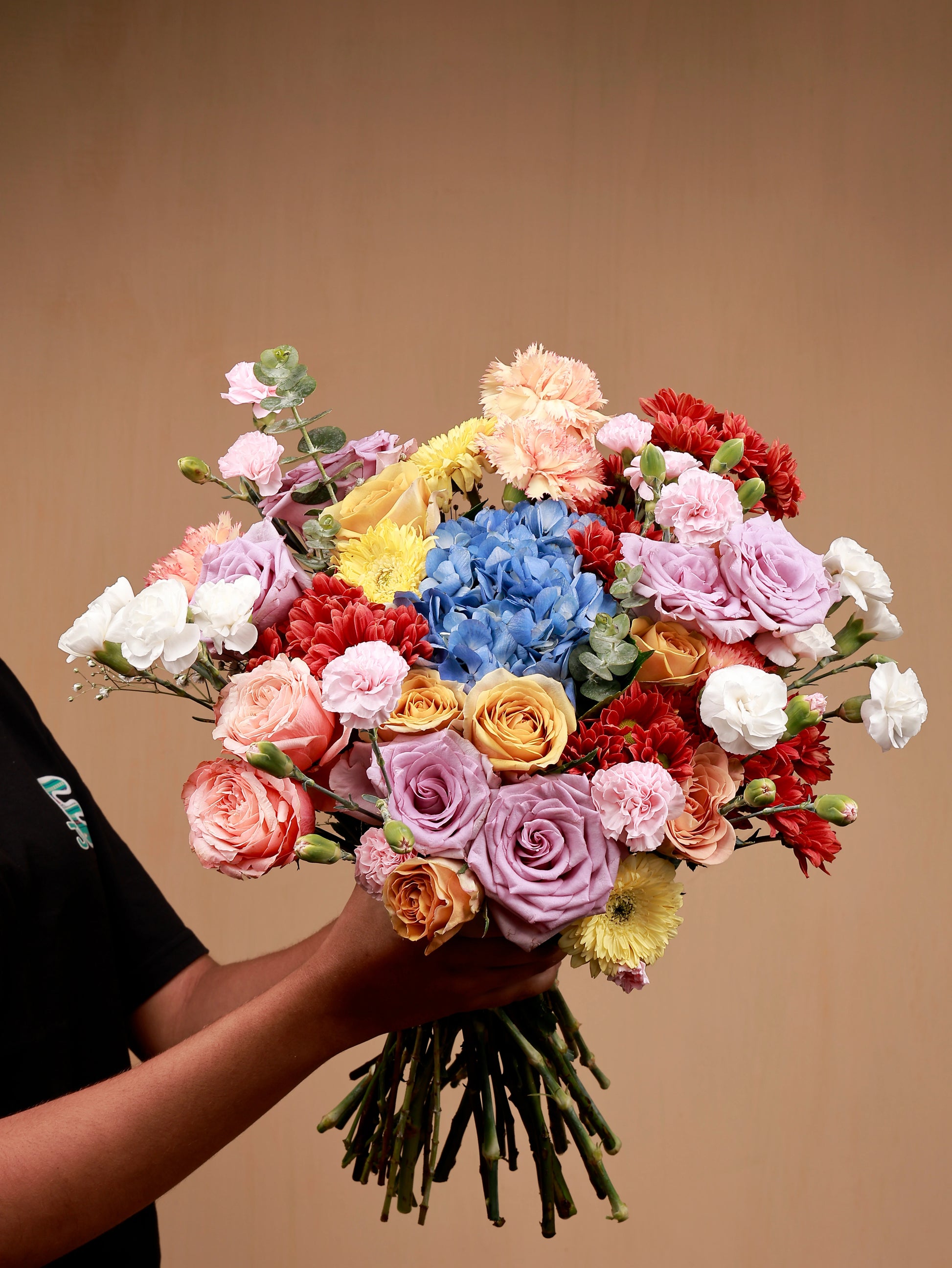 colorful bouquet of flowers in hand