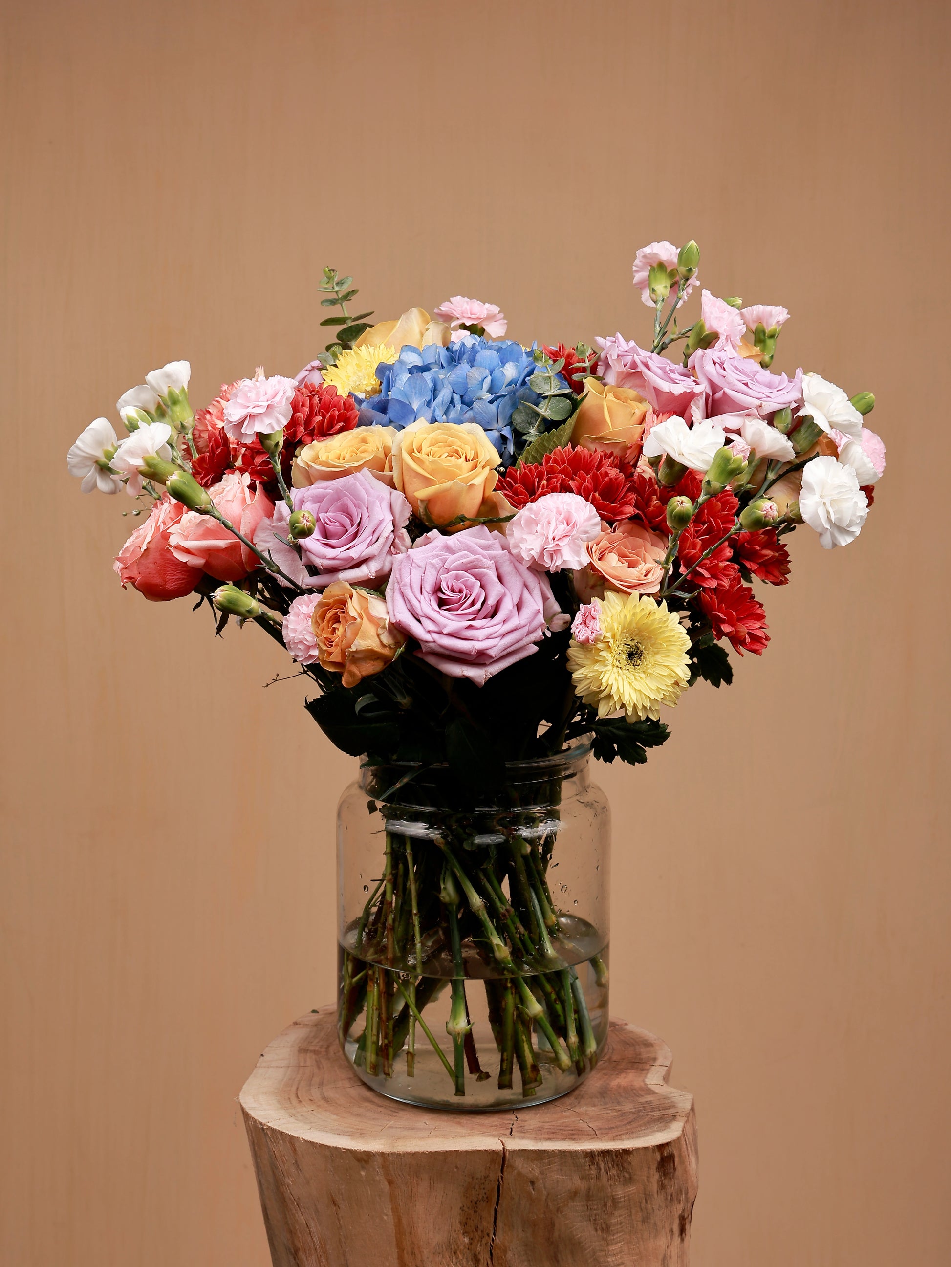 colorful bouquet of flowers in a glass-vase
