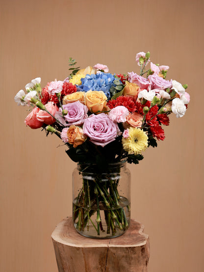 colorful bouquet of flowers in a glass-vase