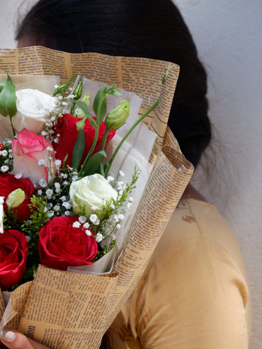 Closeup of white eustoma with red rose and jumilia