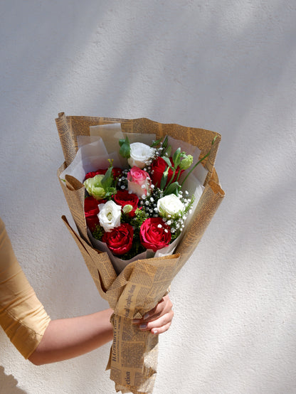 A lovely bouquet in newspaper style wrapper