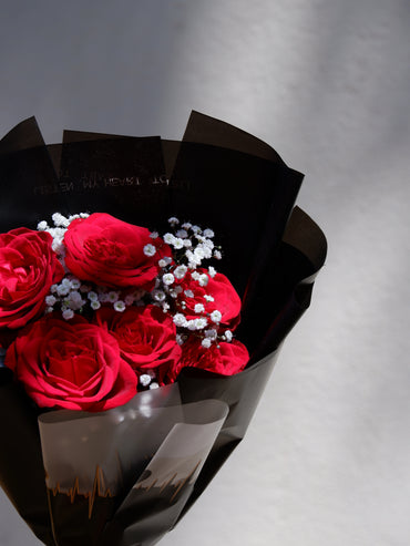 Red roses with baby's breath