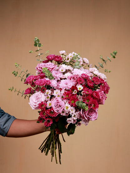 pink flowers in hand