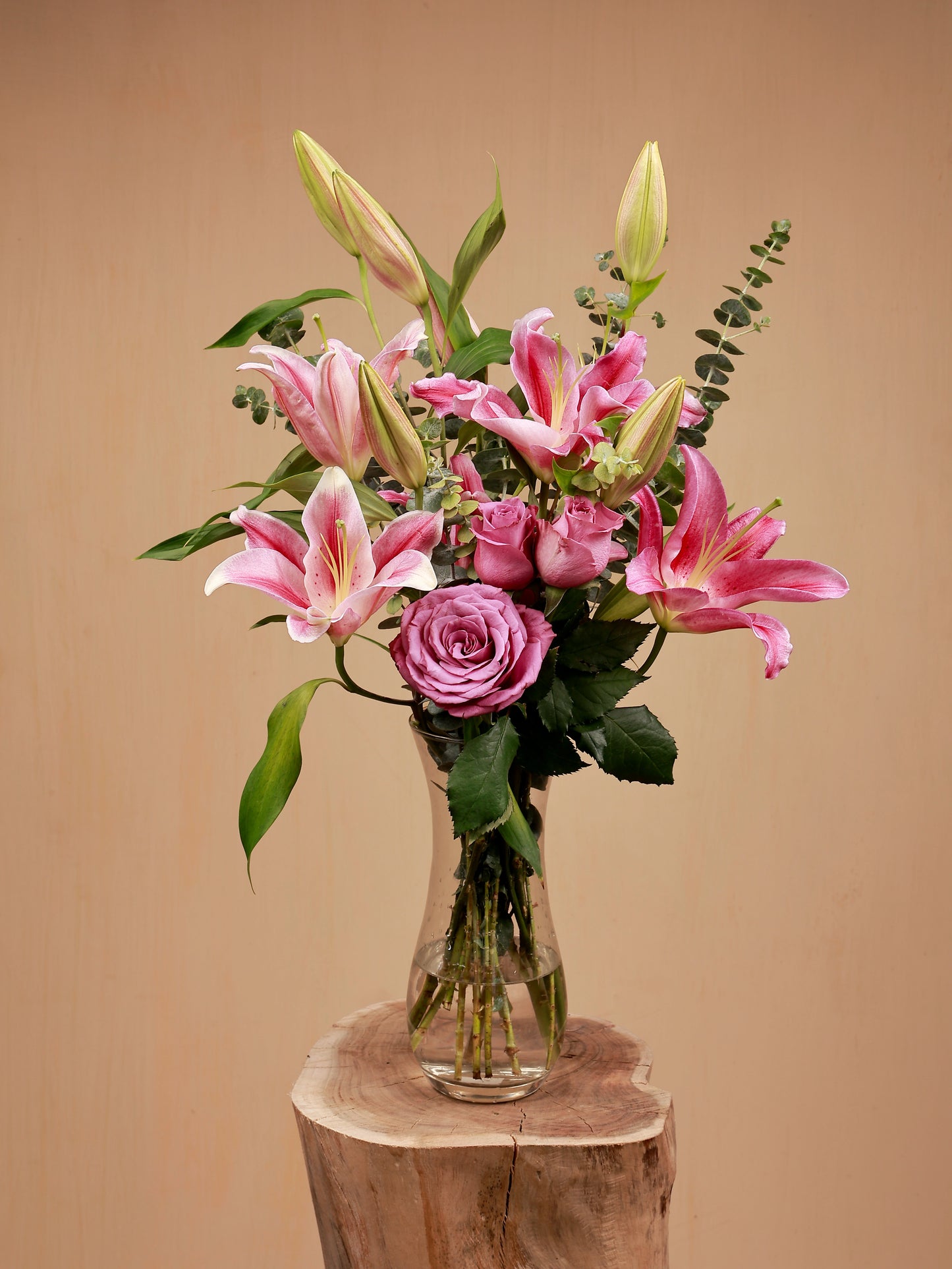 pink lily and new orleans in glass vase